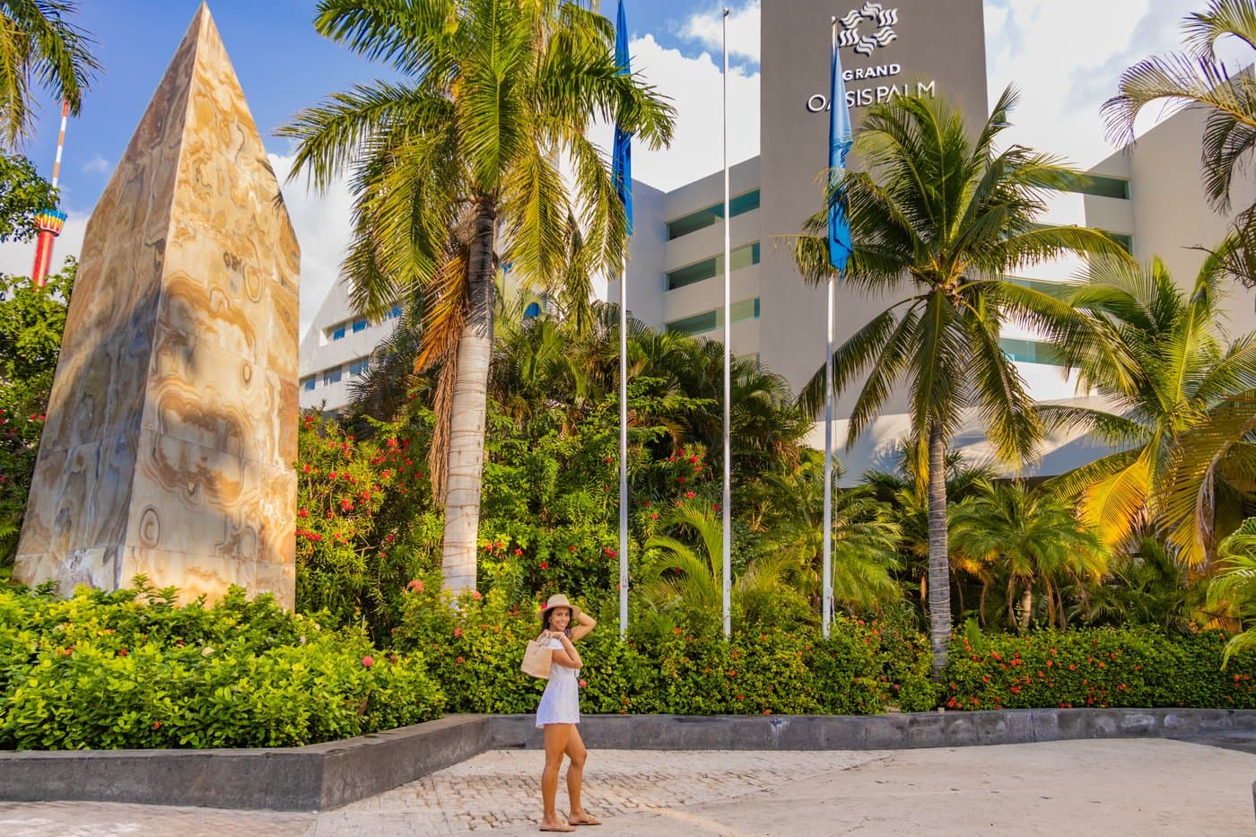 Tropical garden with sculpture at the hotel Oasis Palm.